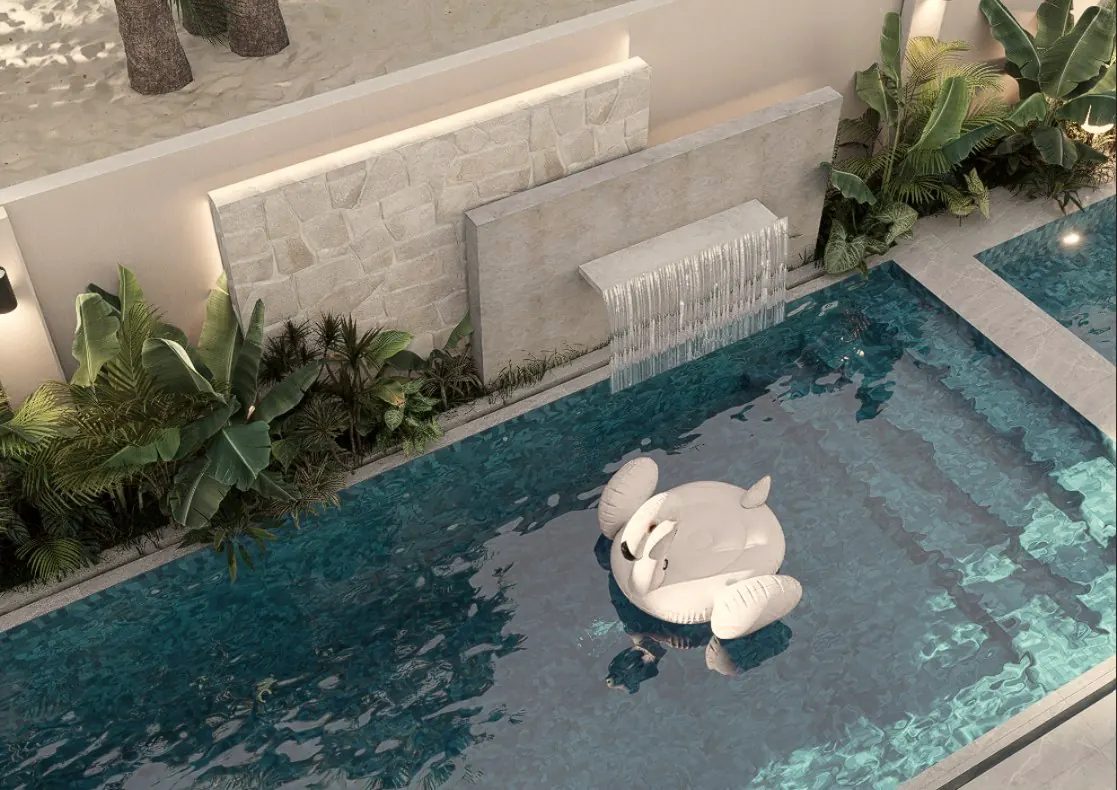 Pool garden with stone feature wall, water spill and tropical planting, Dubai Hills Estate